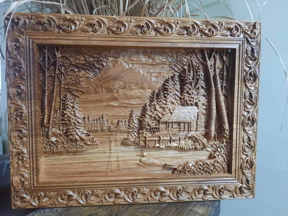 Wooden carved picture In the village 309