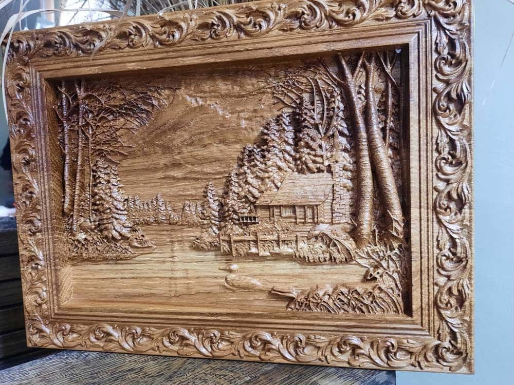 Wooden carved picture In the village 309