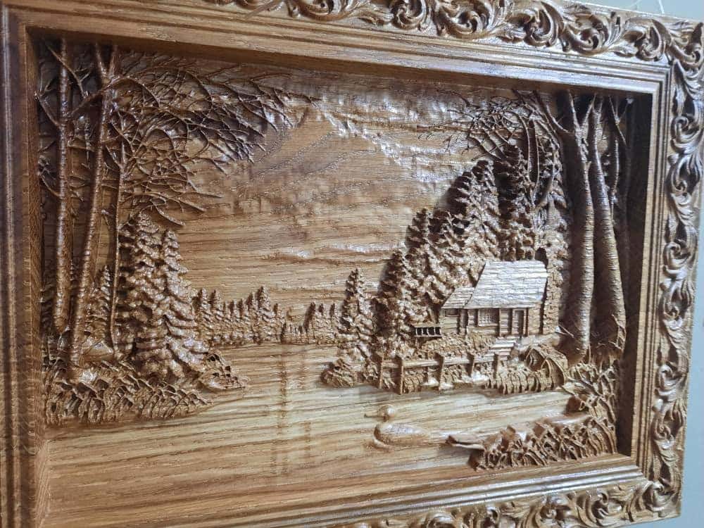 Wooden carved picture In the village 309