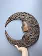 Crescent moon with woman face