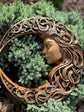 Crescent moon with woman face