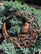 Crescent moon with woman face